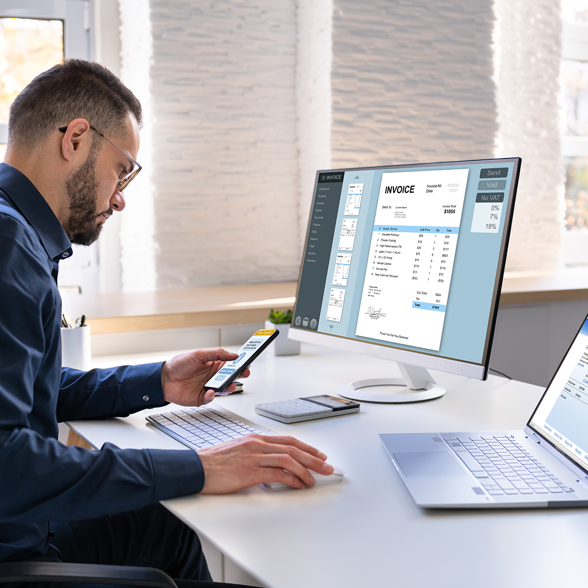 young-businessman-looking-invoice-while-doing-online-banking